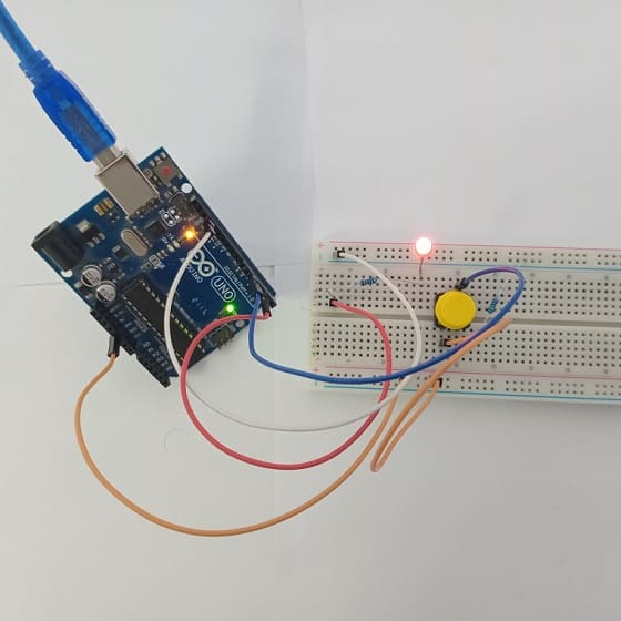 Mounting the Arduino UNO board with the LED and push button